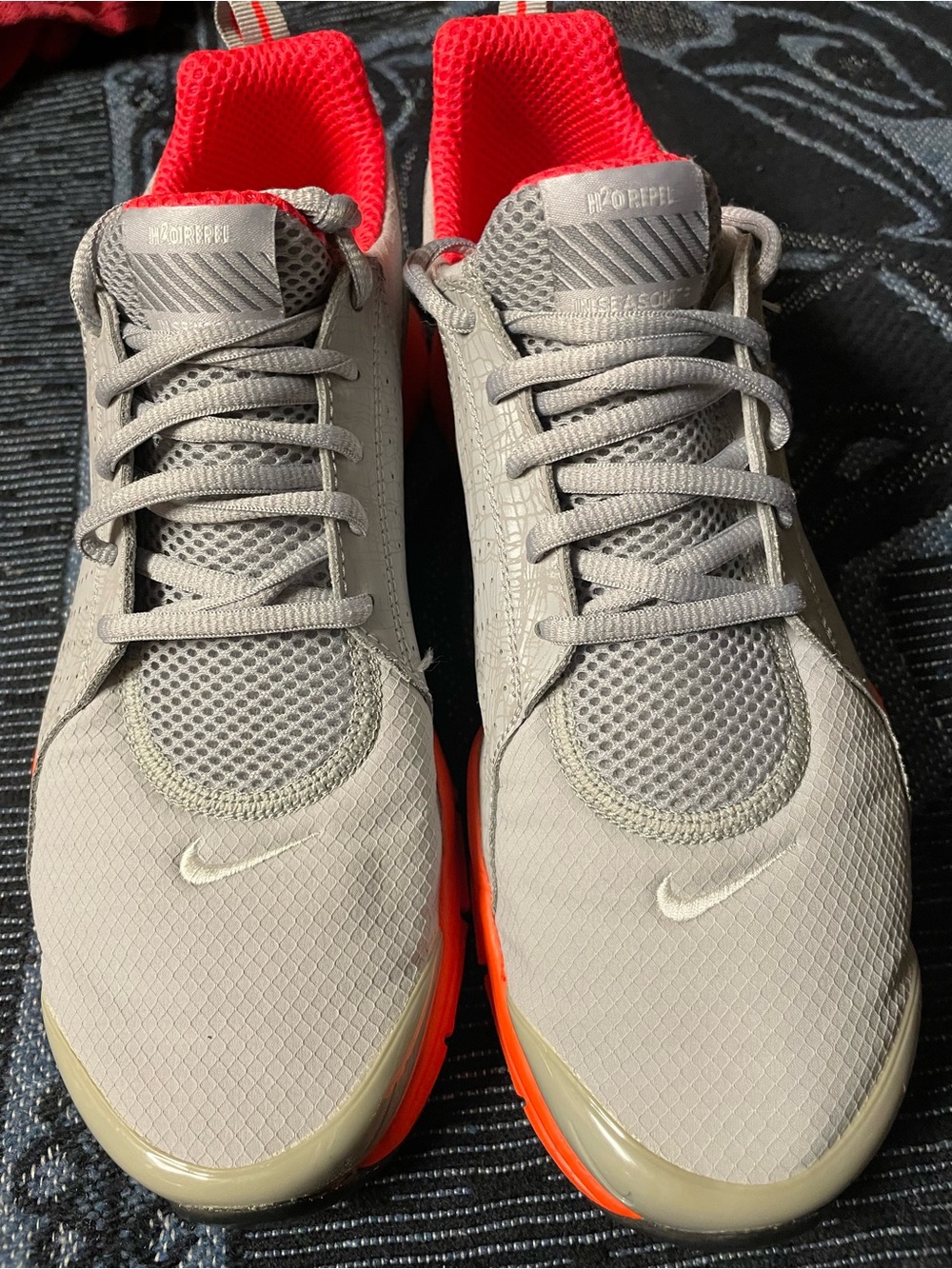 Nike Gray Sneakers with Red Lining and Orange Soles